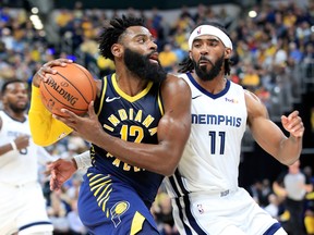Indiana Pacers Tyreke Evans, left, dribbles the ball during the game against the Memphis Grizzlies at Bankers Life Fieldhouse on Oct. 17, 2018 in Indianapolis, Indiana. (Andy Lyons/Getty Images)