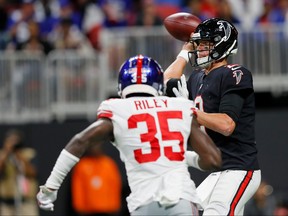 Atlanta Falcons' Matt Ryan, right, looks to pass during the third quarter against the New York Giants at Mercedes-Benz Stadium on Oct. 22, 2018 in Atlanta, Georgia. (Kevin C. Cox/Getty Images)