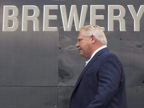 Ontario Premier Doug Ford arrives for the for the buck-a-beer plan announcement at Barley Days brewery in Picton, Ont., on Aug. 7. THE CANADIAN PRESS