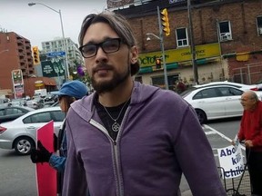 An anti-abortion group filmed this man as he kicked a videographer in the west end last Sunday.