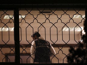 A Turkish forensic police officer shoots video in a room of the Saudi Arabia's Consulate in Istanbul, late Monday, Oct. 15, 2018. (AP Photo/Emrah Gurel)