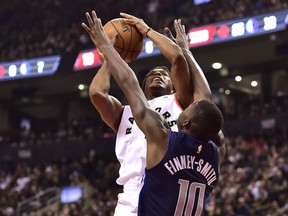 Raptors guard Kyle Lowry drives to the net as Dallas Mavericks forward Dorian Finney-Smith tries to defend on Friday night. (THE CANADIAN PRESS)