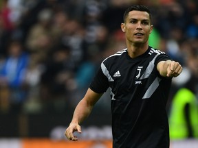 Juventus' Portuguese forward Cristiano Ronaldo gestures as he warms up before the Italian Serie A football match Udinese Calcio vs Juventus FC at the Dacia Arena stadium in Udine on Oct. 6, 2018. (Miguel MEDINA/AFP/Getty Images)