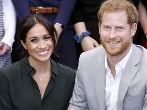 (FILES) In this file photo taken on October 03, 2018 Britain's Prince Harry, Duke of Sussex (R) and Britain's Meghan, Duchess of Sussex (L) meet with young people on a visit to Joff Youth Centre in Peacehaven in East Sussex, southern England. - Prince Harry and his wife Meghan, the Duchess of Sussex, are expecting a baby in the spring of 2019, their official residence said in a statement on October 15, 2018.