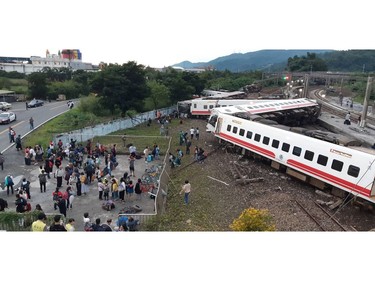 This CNA handout picture taken on Oct.21, 2018 shows a derailed train in Yian, eastern Taiwan.