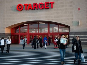 This file photo taken on November 28, 2014 shows shoppers leaving the Target store in Fairfax, Virginia.