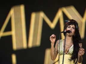 In this file photo dated Friday, July 4, 2008, singer Amy Winehouse performs during the Rock in Rio music festival in Arganda del Rey, on the outskirts of Madrid. (AP Photo/Victor R. Caivano)