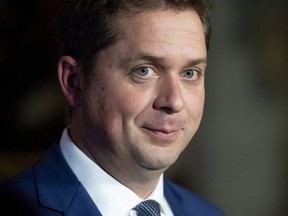 Conservative Leader Andrew Scheer speaks to reporters as he responds to the USMCA trade deal, in the foyer of the House of Commons on Parliament Hill, in Ottawa on Oct. 1, 2018.