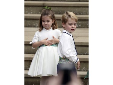 Prince George and Princess Charlotte arrive for the the wedding of Princess Eugenie of York and Jack Brooksbank at St George's Chapel, Windsor Castle, near London, England, Friday Oct. 12, 2018. (Steve Parsons/Pool via AP) ORG XMIT: RWW147