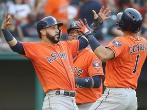 Carlos Correa of the Houston Astros celebrates with Marwin Gonzalez after hitting a home run against the Cleveland Indians during Game 3 of the American League Division Series at Progressive Field on October 8, 2018 in Cleveland. (Gregory Shamus/Getty Images)