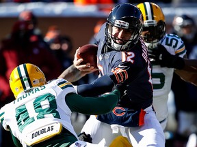 Quarterback Matt Barkley of the Chicago Bears carries the football against Joe Thomas of the Green Bay Packers at Soldier Field on December 18, 2016 in Chicago. (Joe Robbins/Getty Images)