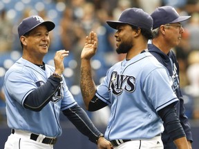 Tampa Bay Rays third base coach Charlie Montoyo, left, will be named the next manager of the Toronto Blue Jays. (Reinhold Matay/AP)