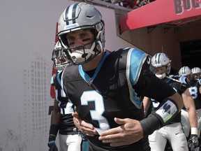 In this Oct. 29, 2017, file photo, Carolina Panthers quarterback Derek Anderson (3) jogs out of the tunnel and onto the field before an NFL football game against the Tampa Bay Buccaneers, in Tampa, Fla. The Buffalo Bills have signed quarterback Derek Anderson to add veteran experience and have him serve as a mentor for rookie starter Josh Allen. The Bills announced the signing Tuesday, Oct. 9, 2018, a day after Anderson visited the team's facility. He has a 20-27 career record over 12 NFL seasons, and spent the past seven serving as Cam Newton's backup in Carolina.