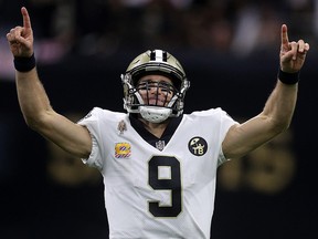 Drew Brees of the New Orleans Saints reacts after throwing a 62 yard pass to take the all time yardage record against the Washington Redskins at Mercedes-Benz Superdome on October 8, 2018 in New Orleans. (Chris Graythen/Getty Images)