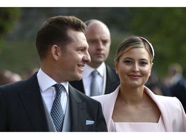 Nick Candy and Holly Candy arrive ahead of the wedding of Princess Eugenie of York and Jack Brooksbank at St George's Chapel, Windsor Castle, near London, England, Friday Oct. 12, 2018. (Gareth Fuller/Pool via AP) ORG XMIT: RWW322