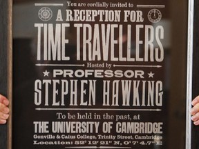 A poster advertising Time Travellers meeting hosted by Stephen Hawking, is one of the personal and academic possessions of Stephen Hawking at the auction house Christies in London, Friday, Oct. 19, 2018.  The online auction announced Monday Oct. 22, 2018, by auctioneer Christie's features 22 items from Hawking, including his doctoral thesis on the origins of the universe, with the sale scheduled for 31 October and 8 November.
