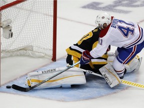 Canadiens' Paul Byron scores against Penguins goaltender Matt Murray in the first period in Pittsburgh on Saturday, Oct. 6, 2018.
