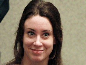 In this July 7, 2011 file photo, Casey Anthony smiles before the start of her sentencing hearing in Orlando, Fla. (AP Photo/Joe Burbank, File)