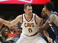 In this Oct. 19, 2018, file photo, Cleveland Cavaliers' Kevin Love, left, is double-teamed by Minnesota Timberwolves' Anthony Tolliver and Jeff Teague, right, in the first half of an NBA basketball game, in Minneapolis.