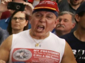 In this Feb. 18, 2017 file photo, Cesar Sayoc is seen as U.S. President Donald Trump speaks during a campaign rally at the AeroMod International hangar at Orlando Melbourne International Airport in Melbourne, Fla.