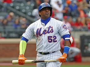 In this Sunday, April 1, 2018 file photo, New York Mets Yoenis Cespedes (52) holds his broken bat during a game against the St. Louis Cardinals in New York. (AP Photo/Kathy Willens, File)