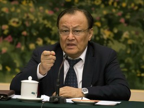 FILE - In this March 12, 2017, file photo, Shohrat Zakir, chairman of the Xinjiang Uyghur Autonomous Region, speaks on the sideline of the National People's Congress in Beijing, China. The senior Chinese official is describing the mass internment of ethnic minority Muslims in the country's far west as a system of training centers that saves Muslims from religious extremism by teaching them to speak Mandarin and accept modern science.  It was a rare instance of the ruling Communist Party publicly detailing its vision of what the extrajudicial detention of an estimated 1 million ethnic minority Uighur and Kazakh Muslims is setting out to achieve.