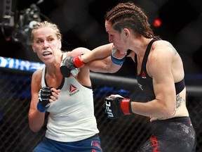 Alexis Davis (right ) fights Katlyn Chookagian during the UFC Fight Night cards at the Saddledome in Calgary on Saturday, July 28, 2018. (Jim Wells/Postmedia)