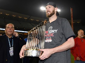 Chris Sale of the Boston Red Sox celebrates with the World Series trophy after his team's win over the Los Angeles Dodgers at Dodger Stadium on October 28, 2018 in Los Angeles. (Harry How/Getty Images)