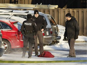 Police examine evidence at the scene after Mohamed Najdi was shot and killed.