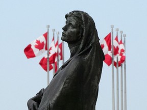 The statue of Veritas (Truth) is shown in front of the Supreme Court of Canada in Ottawa on Wednesday, May 23, 2018.