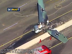 This photo taken from video provided by KABC-TV shows a vintage North American AT-6 airplane that crashed on U.S. 101 in Agoura Hills, Calif., Tuesday, Oct. 23, 2018.  (KABC-TV via AP)