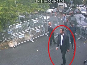 In a frame from surveillance camera footage taken Oct. 2, 2018, and published Thursday, Oct. 18, 2018, by the pro-government Turkish newspaper Sabah, a man identified by Turkish officials as Maher Abdulaziz Mutreb, walks toward the Saudi Consulate in Istanbul before writer Jamal Khashoggi disappeared. Saudi Arabia, which initially called the allegations "baseless," has not responded to repeated requests for comment from The Associated Press over recent days, including on Thursday over Mutreb’s identification. (Sabah via AP)