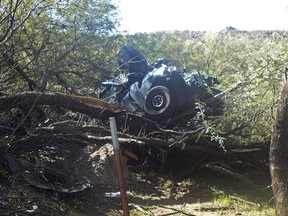 In this Oct. 18, 2018, photo provided by the Arizona Department of Public Safety is the scene where authorities say they rescued a seriously injured woman who spent six days in the desert after crashing her car near Wickenburg, Ariz. (Arizona Department of Public Safety via AP)