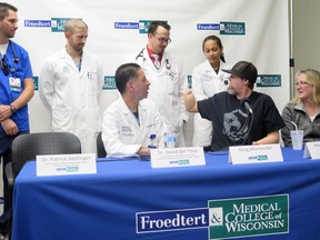 Greg Manteufel, right, thanks medical staff at Froedtert & the Medical College of Wisconsin on Tuesday, Oct.2, 2018, in Milwaukee.
