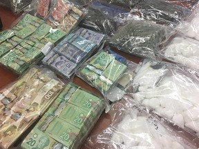 Various drugs, including meth, are displayed in Saskatoon after a bust was made in that city on May 31, 2018. (THE CANADIAN PRESS/HO-Saskatoon Police Service)