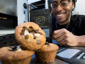 Yannick Craigwell shows off some of his edible marijuana baked treats in Vancouver, Wednesday, Oct. 3, 2018.