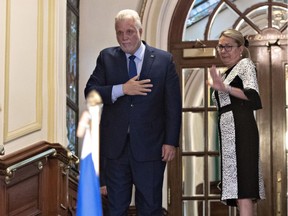 Outgoing Quebec Premier Philippe Couillard announced his resignation in an emotional news conference Thursday alongside his wife, Suzanne Pilote.