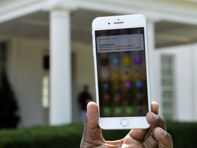 The first test of the national wireless emergency system by the Federal Emergency Management Agency is shown on a cellular phone at the White House in Washington, Wednesday, Oct. 3, 2018. About 225 million electronic devices across the United States received alerts from FEMA Wednesday afternoon.