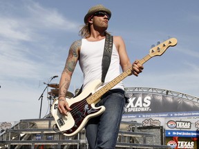 In this April 9, 2011 file photo, 3 Doors Down' bassist Todd Harrell performs before a NASCAR auto race at Texas Motor Speedway in Fort Worth, Texas.  (AP Photo/Tim Sharp, File)