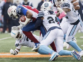 Montreal Alouettes' William Stanback (31) pushes through Toronto Argonauts defense during first half CFL football action in Montreal, Sunday, Oct. 28, 2018. THE CANADIAN PRESS/Graham Hughes