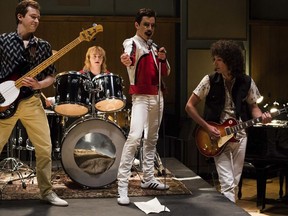 This image released by Twentieth Century Fox shows Joe Mazzello, from left, Ben Hardy, Rami Malek and Gwilym Lee in a scene from "Bohemian Rhapsody."