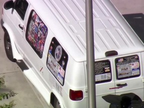 This frame grab from video provided by WPLG-TV shows a van parked in Plantation, Fla., on Friday, Oct. 26, 2018, that federal agents and police officers have been examining in connection with package bombs that were sent to high-profile critics of President Donald Trump.