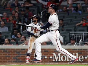 Freddie Freeman of the Atlanta Braves reacts after hitting a solo home run in the sixth inning against the Los Angeles Dodgers during Game Three of the National League Division Series at SunTrust Park on Oct. 7, 2018 in Atlanta, Ga.