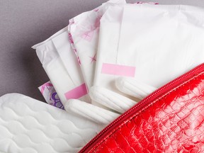 Menstrual tampons and pads in cosmetic bag are pictured in this file photo. (Getty Images)