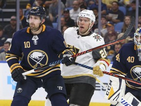 Buffalo Sabres forward Patrik Berglund (10) and Vegas Golden Knights forward Paul Stastny (26) battle in front of net during the second period of an NHL hockey game, Monday, Oct. 8, 2018, in Buffalo N.Y.