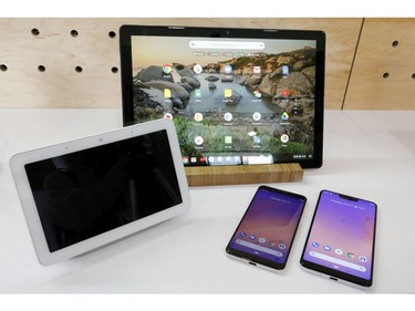 The Google Home Hub, left, Pixel Slate, centre, and two new smartphones are displayed in New York, Tuesday, Oct. 9, 2018.