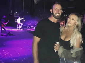 Dustin Johnson and Paulina Gretzky attend a Kid Rock concert.