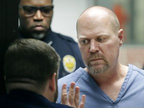 Gregory Bush, right, is arraigned on two counts of murder and 10 counts of wanton endangerment Thursday, Oct. 25, 2018, in Louisville, Ky.