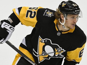 Pittsburgh Penguins left wing Carl Hagelin warms up before the third period of an NHL game against the New York Islanders in Pittsburgh, Tuesday, Oct. 30, 2018. The Pittsburgh Penguins are wearing a "Stronger than Hate" logo on their uniforms in memory of the victims of a shoot at a Pittsburgh synagogue on Oct. 27, 2018.