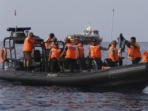 Rescuers conduct search operation in the waters of Ujung Karawang, West Java, Indonesia after a Lion Air plane crashed into the sea Monday, Oct. 29, 2018. A Lion Air flight crashed into the sea just minutes after taking off from Indonesia's capital on Monday in a blow to the country's aviation safety record after the lifting of bans on its airlines by the European Union and U.S. (AP Photo/Achmad Ibrahim)